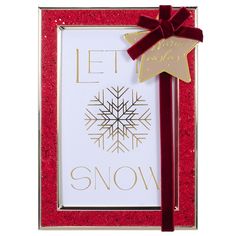 a red and gold christmas card with a snowflake on the front that says let it snow