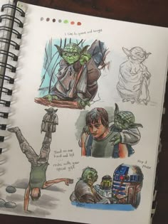 an open notebook with drawings of people doing different things in the image and on it is a drawing of yoda from star wars