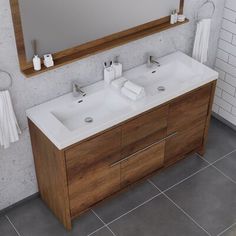 a bathroom vanity with two sinks and a large mirror