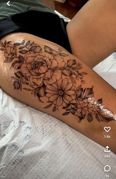 a woman's thigh with flowers on it