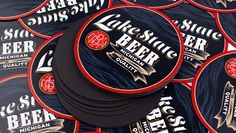 several beer coasters stacked on top of each other with the label's name printed on them