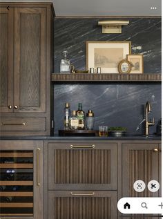 a kitchen with wooden cabinets and marble counter tops, along with an appliance