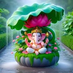 an elephant statue sitting on top of a lush green plant next to a pond filled with water