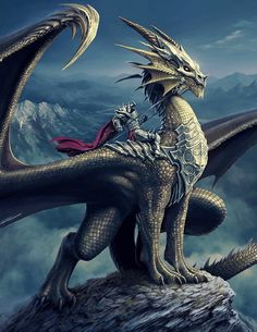 a dragon sitting on top of a mountain next to a man with a red cape