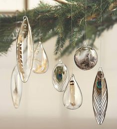 an ornament hanging from a christmas tree with ornaments in the shape of tears