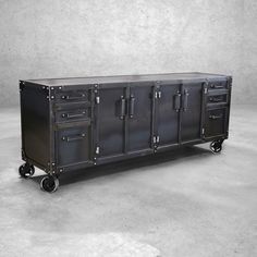 a large metal cabinet with four drawers on wheels