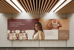 a woman's bra hanging on the wall next to a sign that says yoga aguar