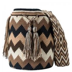 a brown and white bag with tassels on it