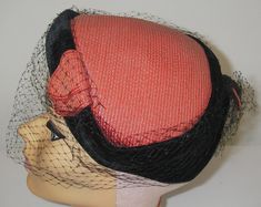 Vintage Woman's Hat    Style:  Juliette Cap Half Hat with veil Lining:   Yes   Sweatband:   Yes Ribbon Label:   No Color:  Coral and Black Circa:  1950s Material: Black Velvet accents   Label:  None,   Stamp:  None Size: Adult   Condition:   Vintage, veil has tears (Please see supersized photos) I examine each item carefully and note any imperfections, but unless an item is said to be new, please don't expect it to be perfect.   I list the obvious imperfections to the best of my abilities. Howev Vintage Veil, Ribbon Label, 1950s Woman, Hat With Veil, Cap Veil, Velvet Accents, Fashion 1950s, Color Coral, Hat Cap