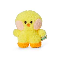 a small yellow stuffed animal sitting on top of a white surface with a tag in it's ear