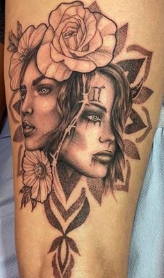 a woman's leg with tattoos on it and a rose in the middle of her head