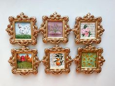 four gold framed pictures hang on the wall next to each other with flowers and birds in them