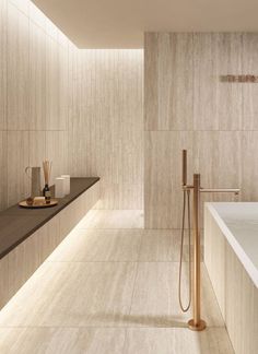 a bath room with a large tub and a sink