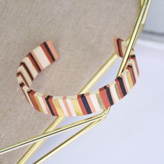 a pair of bracelets sitting on top of a chair