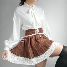 a woman in a skirt and shirt posing for the camera