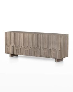 the sideboard is made out of wood and has an unusual design on it's sides