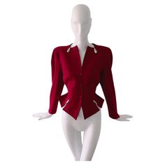 Stunning red Thierry Mugler blazer jacket with amazing silver bulllet details. Hiver Buick collection FW 1989. Adorned with chrome ornaments inspired by the 1959 Cadillac Eldorado. Very rare Thierry Mugler creation. Avant-garde & drama. Dark bordeaux red fitted Wool blazer with shiny silver metal bullet elements. Deep V-neck, Zigzag cutouts and typical Mugleresque fitted waist, feminine silhouette and strong shoulders. Closes with snap buttons on the front. Highlights are the silver metal bullet Mugler Blazer, Off Shoulder Jacket, Front Highlights, Girls Corset, Strong Shoulders, Silver Bullet, Cadillac Eldorado, Red Fits, Thierry Mugler