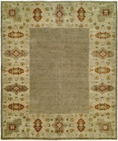 a beige rug with red and green accents