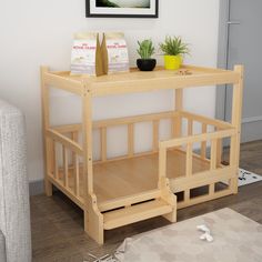 there is a small wooden table with shelves on the top and bottom, along with two potted plants