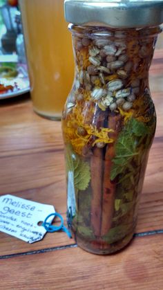 a jar filled with food sitting on top of a wooden table