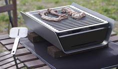 there is a grill that has some sausages on it