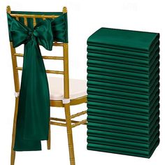 a stack of green chair covers next to a stack of gold chairs with bows on them