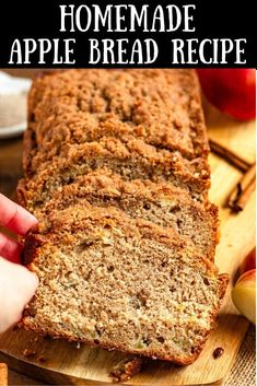 a person holding a loaf of homemade apple bread