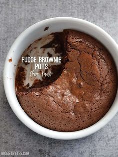 fudge brownie potts for two in a white bowl on a gray surface