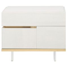 a white and gold dresser with drawers