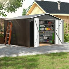 a garage with the door open and shelves full of items in it next to a house