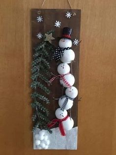 a snowman is hanging on the door