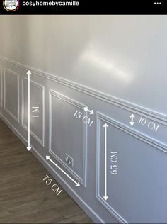 an image of a room with measurements on the wall and flooring in front of it