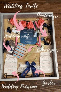 the contents of a wedding gift in a box on a wooden table with pink and blue ribbons