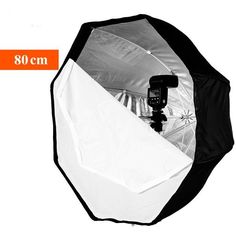 a white and black photo studio with an umbrella