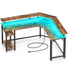 a computer desk with a blue light under the top and an iron pipe underneath it