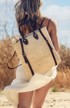 Embrace artisanal elegance with the Moroccan Shopping Basket Backpack, hand-woven from palm by skilled Moroccan artisans and featuring durable leather straps. This versatile backpack is perfect for market trips, beach days, or adding a stylish touch to your daily commute. Each piece showcases intricate craftsmanship, blending traditional techniques with modern functionality. Carry your essentials in a unique, eco-friendly fashion with this beautifully crafted basket backpack. Height with handles Summer Rectangular Backpack For Daily Use, Summer Standard Backpack With Adjustable Strap, Natural Color Travel Backpack, Bohemian Backpack In Natural Color For Everyday Use, Rectangular Natural Backpack For Travel, Rectangular Summer Backpack For Everyday Use, Bohemian Style Natural Color Backpack For Everyday Use, Natural Color Backpack With Adjustable Strap, Natural Backpack With Adjustable Strap