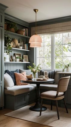 a living room filled with furniture next to a window covered in bookshelves and windows