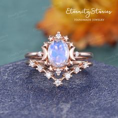 "Star and Moon Engagement Ring Moonstone Engagement Ring Vintage Celestial Wedding Ring Women Set curved Diamond Rose Gold Oval Cut Ring 2PCS ✧✧Jewelry detail✧✧ Item As Shown in Solid 14K Rose Gold Also available in white gold, yellow gold / Solid 14K & 18K Engagement ring ✦ Center stone: 6*8mm oval cut moonstone ✦ Side stones: 0.05ct Colorless Moissanite / Natural Diamond (H, SI) (select the accents type at the dropdown menu) ✦ Shank width: 1.5mm ✦ Shank thickness at the bottom: 1.2mm Wedding R Opal Wedding Ring Set, Rose Gold Engagement Ring Set, Moonstone Engagement Ring Set, Opal Engagement Ring Set, Wedding Ring Sets Unique, Deco Rose, Pearl Engagement Ring, Opal Wedding, Opal Wedding Rings