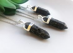 "Beautiful genuine black lava necklace, made of natural black lava stone, stainless steel chain, lead and nickel free. Pendant size appr 2 cm. Lava Stone is a grounding stone that strengthens one's connection to Mother Earth. It gives us strength and courage, allowing us stability through times of change.  It provides guidance and understanding in situations where we may need to \"bounce back\". A calming stone, it is very useful in dissipating anger.  It promotes positive changes where needed in behavioural issues. Lava Stone enhances fertility. In addition, Lava Stone is a wonderful aromatherapy essential oil diffuser.  Simply add a few drops of your favourite essential oil and enjoy the added therapeutic benefits it brings. Each stone will exhibit slight variations in shape, color, and Lava Crystal, Black Crystal Necklace, Hippy Gifts, Positive Changes, Necklace Men, Calming Stones, Bounce Back, Lava Stone, Lovely Earrings