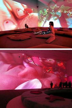 two pictures of people sitting on the ground in front of a large screen with pink lights