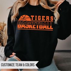 Custom Basketball Shirt, Basketball Team Shirt, Basketball Fan Shirt, Team Mom Gift, Custom Basketball Gift, Tigers Basketball Custom Team Name Custom Colors Short and Long Sleeve - Adult Unisex Fit Bella Brand Crewneck and Hoodie - Gildan Softstyle Unisex Fit (If you prefer one brand over another, just leave me a note at checkout) Matte designs will be DTF, Glitter will be HTV (vinyl) DTF About the print:  The design on this tee is DTF "direct to film" meaning the design is printed on film with special ink then cured and pressed onto the garment. The design will sit on top of the fabric, you will be able to feel the design but the design has a lot softer feel than vinyl but still with very vibrant colors. All materials used are high quality, professional grade. Basketball Mom Shirt Ideas, Basketball Fan Shirts, Tigers Basketball, Team Mom Gifts, Basketball Custom, Basketball Gifts, Team Mom, Custom Basketball, Basketball Shirts