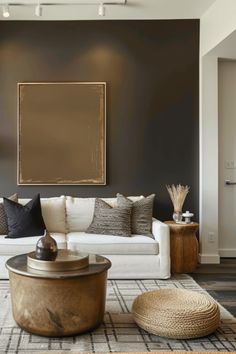 a living room filled with lots of furniture and decor on top of a hard wood floor