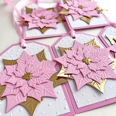 some pretty pink and gold cards on a table