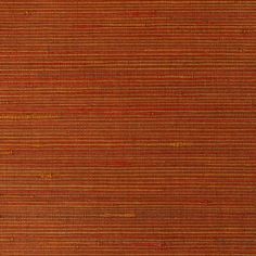 an orange and red rug with vertical stripes on it's surface, in the middle of