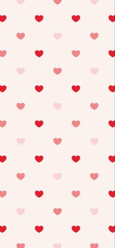 red and pink hearts on a white wallpaper with polka dot pattern in the background