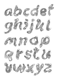 the alphabet is made out of silver foil and has been drawn with black ink on white paper