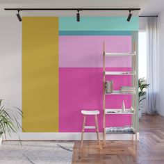 a living room with pink, yellow and white walls