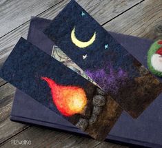 three pieces of felt with different designs on them