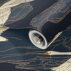 an image of a wallpaper with blue and gold designs on the surface, including two birds