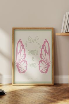 a framed poster with the words graceful as wings on it